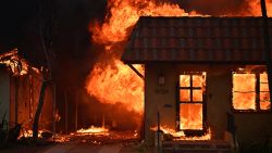 A home burns during the Palisades Fire in Pacific Palisades, California, on January 8, 2025. At least five people have been killed in wildfires rampaging around Los Angeles, officials said on January 8, with firefighters overwhelmed by the speed and ferocity of multiple blazes. (Photo by AGUSTIN PAULLIER / AFP) (Photo by AGUSTIN PAULLIER/AFP via Getty Images)