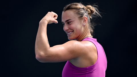 Aryna Sabalenka of Belarus shows her muscles during a training session ahead of the Australian Open tennis tournament in Melbourne on January 9, 2025. (Photo by William WEST / AFP) / --IMAGE RESTRICTED TO EDITORIAL USE - STRICTLY NO COMMERCIAL USE-- (Photo by WILLIAM WEST/AFP via Getty Images)