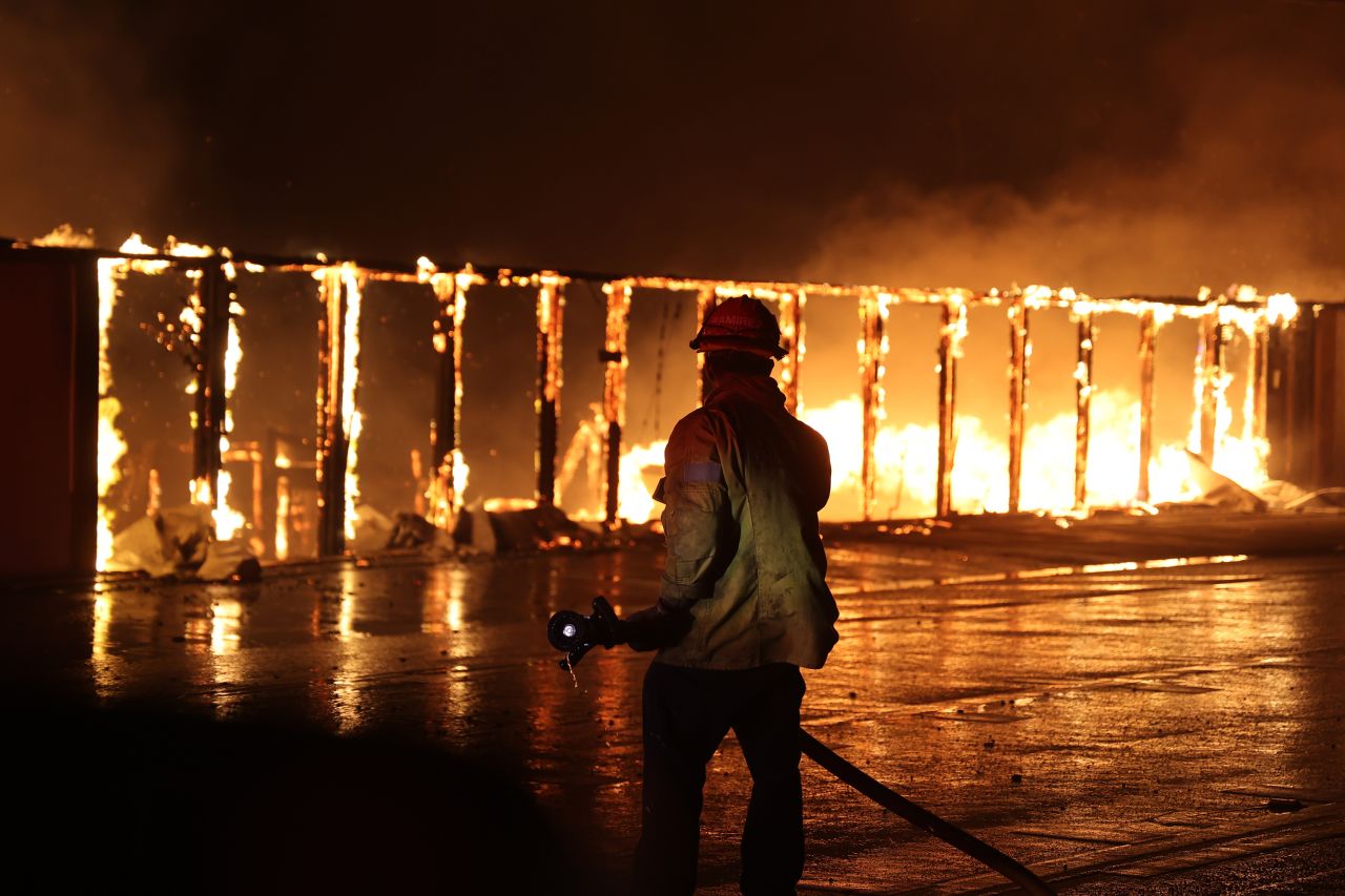 Firefighters continue battling Palisades fire as flames rage across Los Angeles, on January 9.