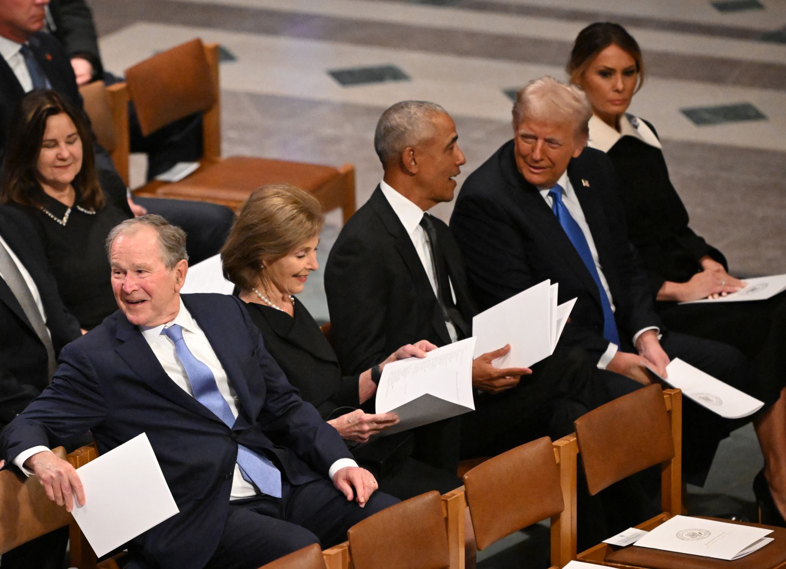 From left, the Bushes, Obama and the Trumps sit together at the funeral.