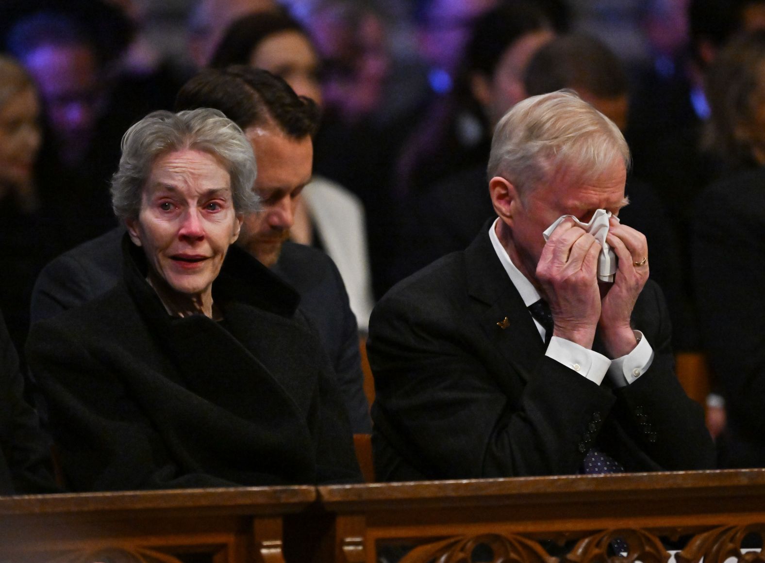 Carter's eldest son, Jack, attends the funeral with his wife, Elizabeth.