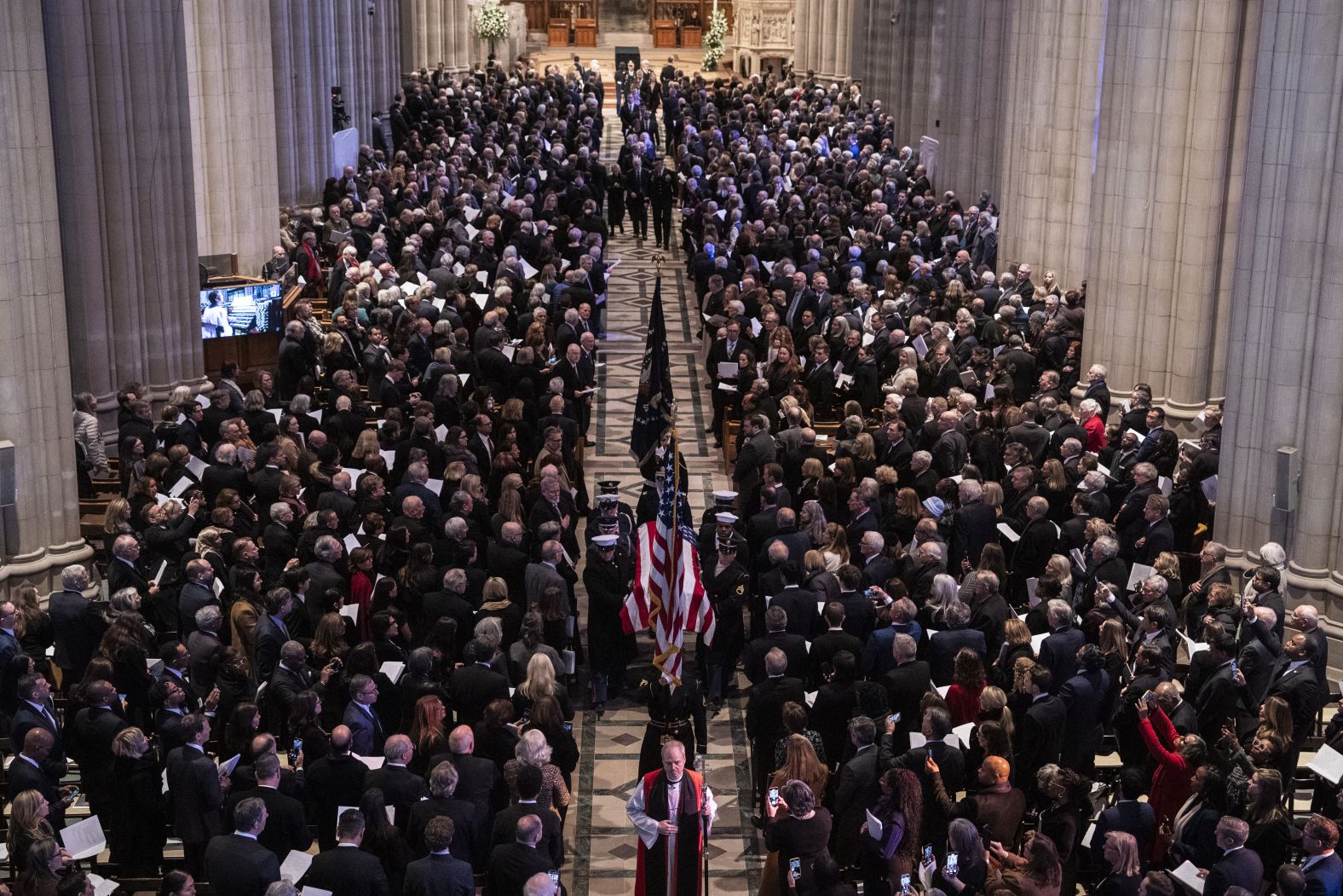 Carter's casket is carried away after his funeral service.