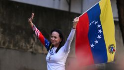 Venezuelan opposition leader Maria Corina Machado waves a national flag during a protest called by the opposition on the eve of the presidential inauguration, in Caracas on January 9, 2025. Venezuela is on tenterhooks facing demonstrations called by both the opposition and government supporters. Machado emerged from hiding to lead protests in Caracas against the swearing-in of Nicolas Maduro for a highly controversial third term as president. (Photo by Juan BARRETO / AFP) (Photo by JUAN BARRETO/AFP via Getty Images)