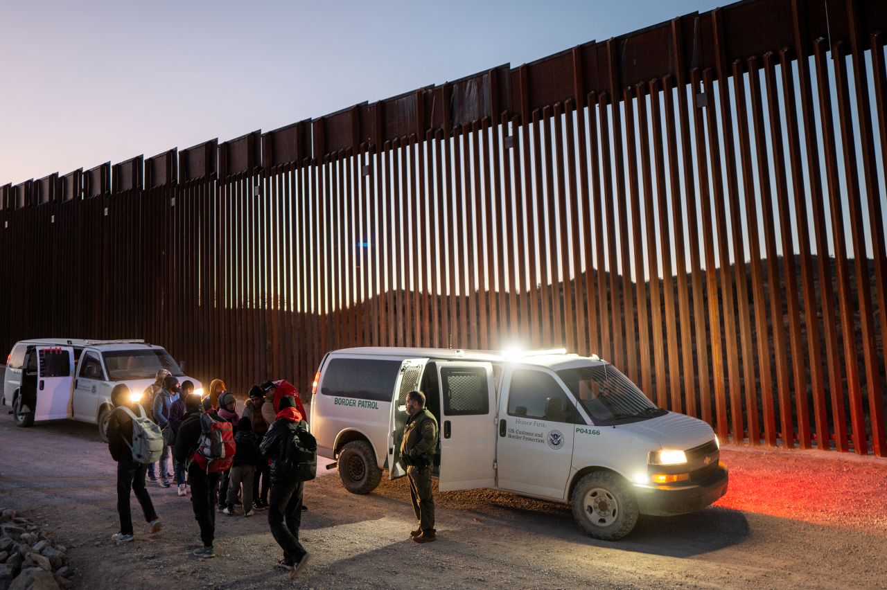 Migrants turn themselves in to US Customs and Border Patrol officers after crossing into Ruby, Arizona on January 5.