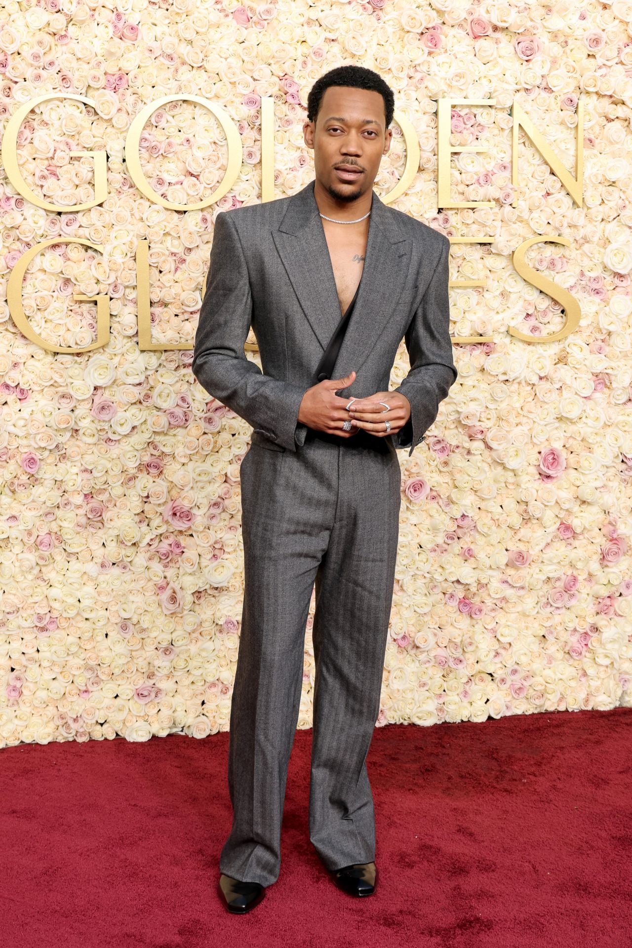 Tyler James Williams poses on the red carpet.