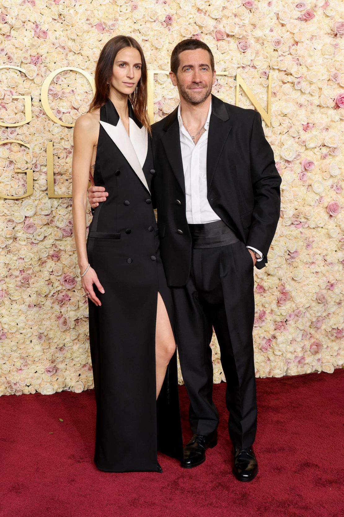 Jeanne Cadieu's black and white outfit complemented Jake Gyllenhaal's wool Prada tuxedo.