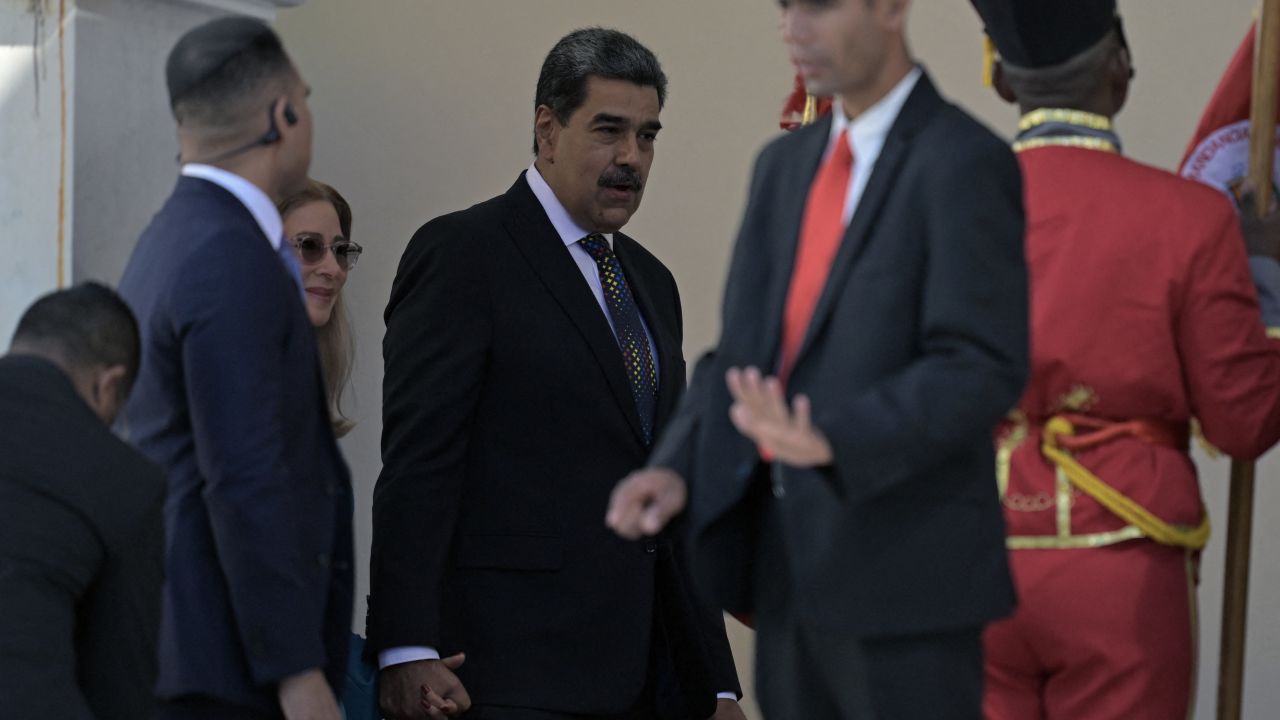 Venezuela's President Nicolas Maduro (C) and First Lady Cilia Flores arrive at the National Congress for the presidential inauguration, in Caracas on January 10, 2025. Maduro, in power since 2013, will take the oath of office for a third term despite a global outcry that brought thousands out in protest on the ceremony's eve. (Photo by JUAN BARRETO / AFP) (Photo by JUAN BARRETO/AFP via Getty Images)