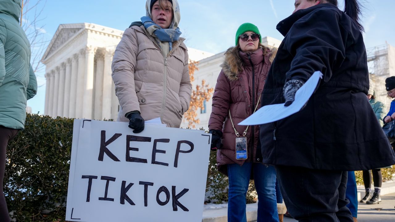 WASHINGTON, DC - JANUARY 10: (L-R) Sarah Baus of Charleston, S.C., holds a sign that reads "Keep TikTok" as she and other content creators Sallye Miley of Jackson, Mississippi, and Callie Goodwin of Columbia, S.C., stand outside the U.S. Supreme Court Building as the court hears oral arguments on whether to overturn or delay a law that could lead to a ban of TikTok in the U.S., on January 10, 2025 in Washington, DC. The future of the popular social media platform is at stake as the Supreme Court hears arguments on a law set to take effect the day before Inauguration Day that would force their China-based parent company to cut ties with TikTok due to national security concerns. (Photo by Andrew Harnik/Getty Images)