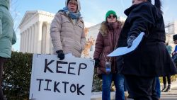 WASHINGTON, DC - JANUARY 10: (L-R) Sarah Baus of Charleston, S.C., holds a sign that reads "Keep TikTok" as she and other content creators Sallye Miley of Jackson, Mississippi, and Callie Goodwin of Columbia, S.C., stand outside the U.S. Supreme Court Building as the court hears oral arguments on whether to overturn or delay a law that could lead to a ban of TikTok in the U.S., on January 10, 2025 in Washington, DC. The future of the popular social media platform is at stake as the Supreme Court hears arguments on a law set to take effect the day before Inauguration Day that would force their China-based parent company to cut ties with TikTok due to national security concerns. (Photo by Andrew Harnik/Getty Images)