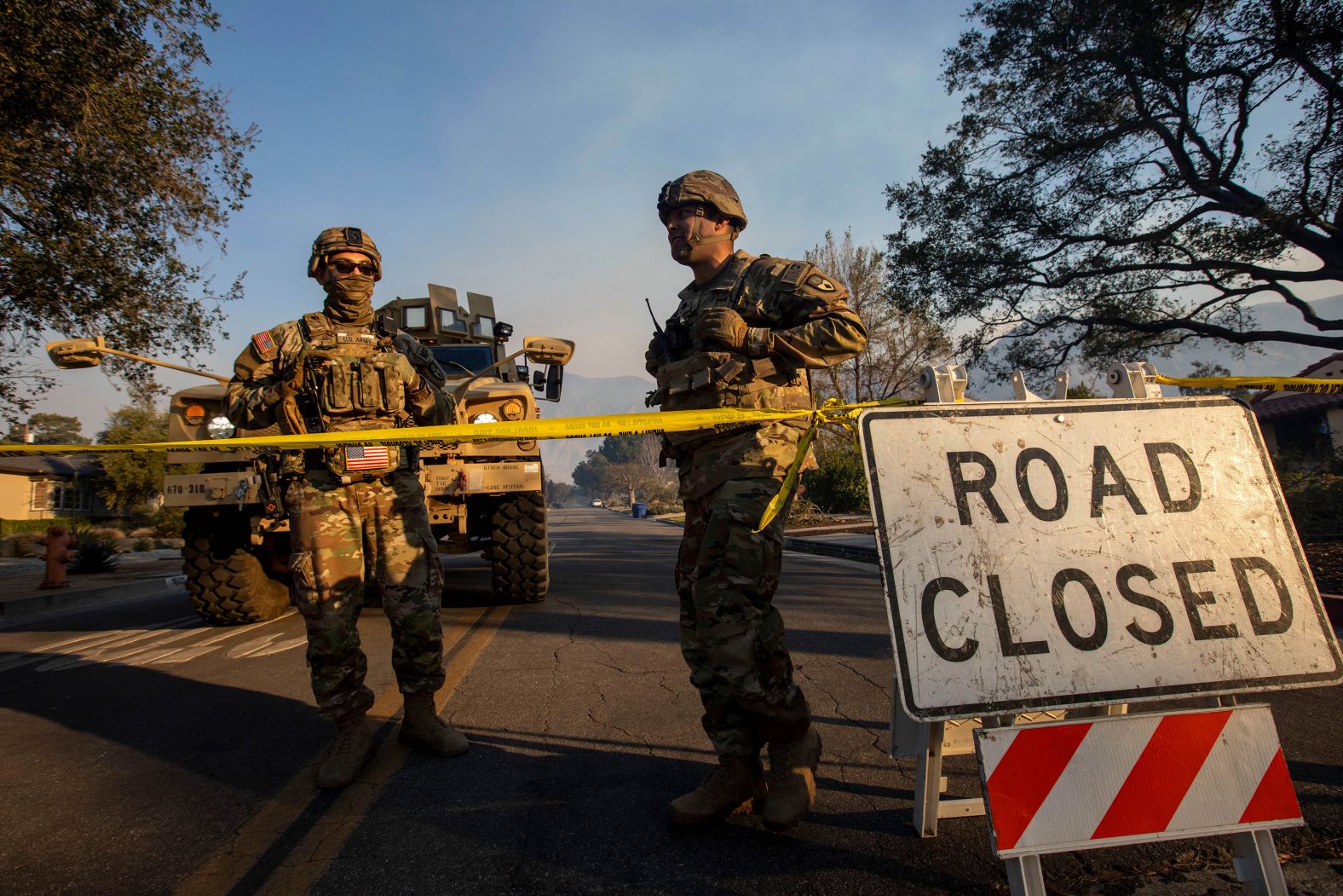 Members of the National Guard block entrances along New York Drive in Altadena.