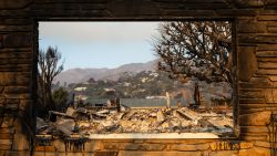 The rubble of a home destroyed in the Palisades Fire is seen through a window frame in the Pacific Palisades neighborhood of Los Angeles, California, on January 10, 2025. Massive wildfires that engulfed whole neighborhoods and displaced thousands in Los Angeles have killed at least 10 people, authorities said, as California's National Guard soldiers readied to hit the streets to help quell disorder.
News of the growing toll, announced late Thursday January 9 by the Los Angeles County Medical Examiner, came as swaths of the United States' second-largest city lay in ruins. (Photo by Zoë Meyers / AFP) (Photo by ZOE MEYERS/AFP via Getty Images)