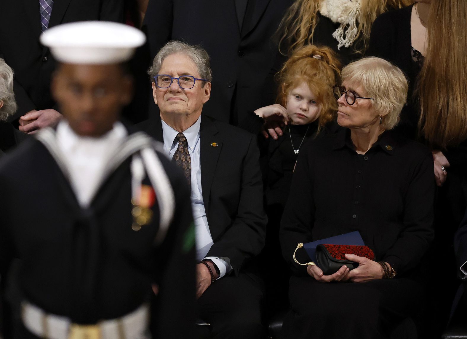 Members of the Carter family, including Carter's son James Earl “Chip” Carter and his wife, Becky, attend a memorial service at the Capitol on January 7.