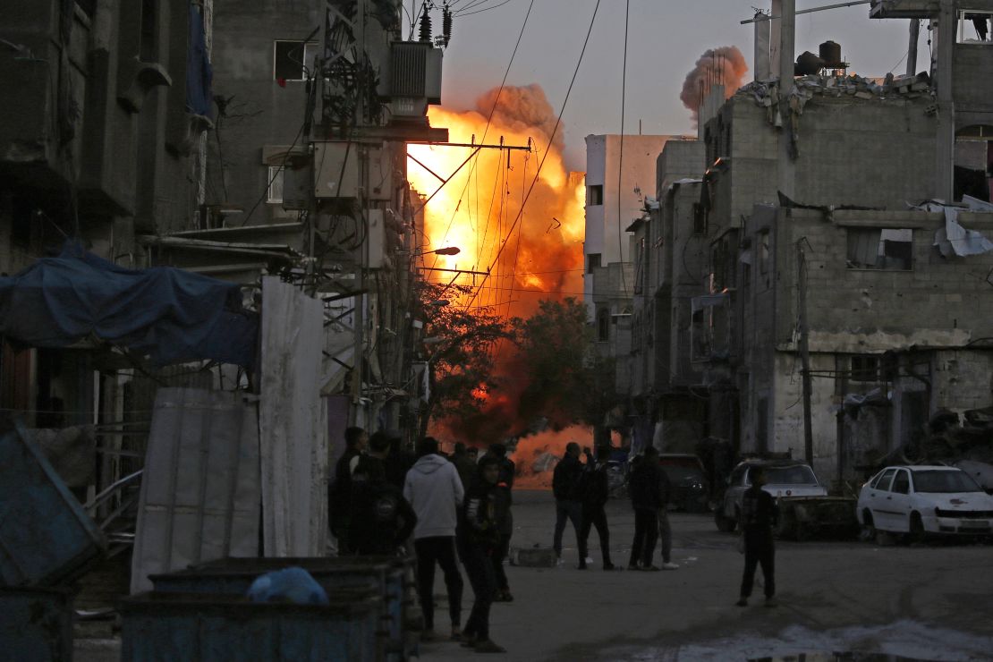 Smoke rises from a building destroyed in Israeli airstrike at the Bureij camp for Palestinian refugees in the central Gaza Strip on January 12, 2025, as the war between Israel and Hamas militants continues.