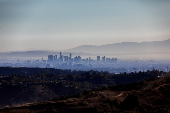 Wildfire smoke covers downtown Los Angeles, as seen from Encino Hills.