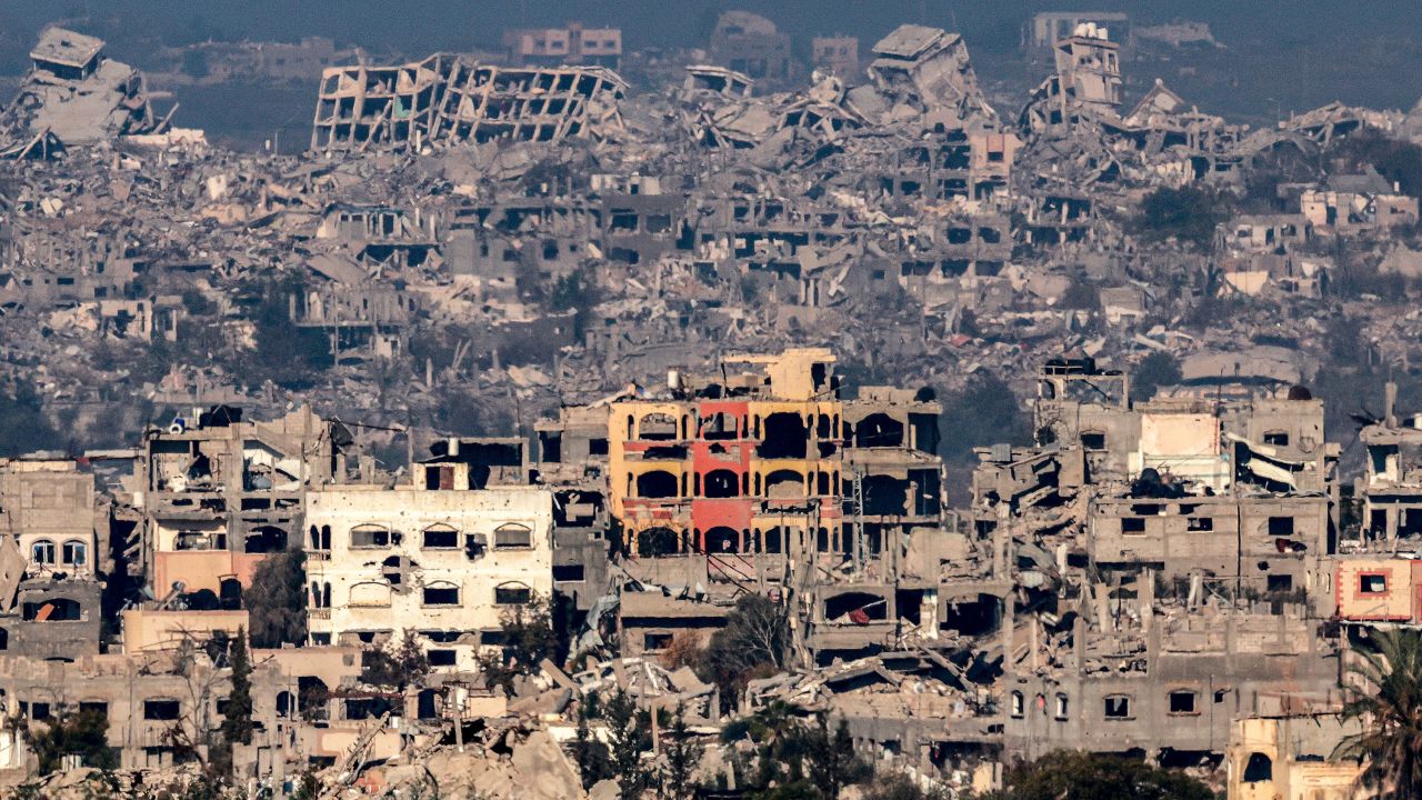 TOPSHOT - This picture taken from the Israeli side of the border with the Gaza Strip shows destroyed buildings in the northern Gaza Strip on January 13, 2025 amid the ongoing war between Israel and Hamas. (Photo by Menahem KAHANA / AFP) (Photo by MENAHEM KAHANA/AFP via Getty Images)