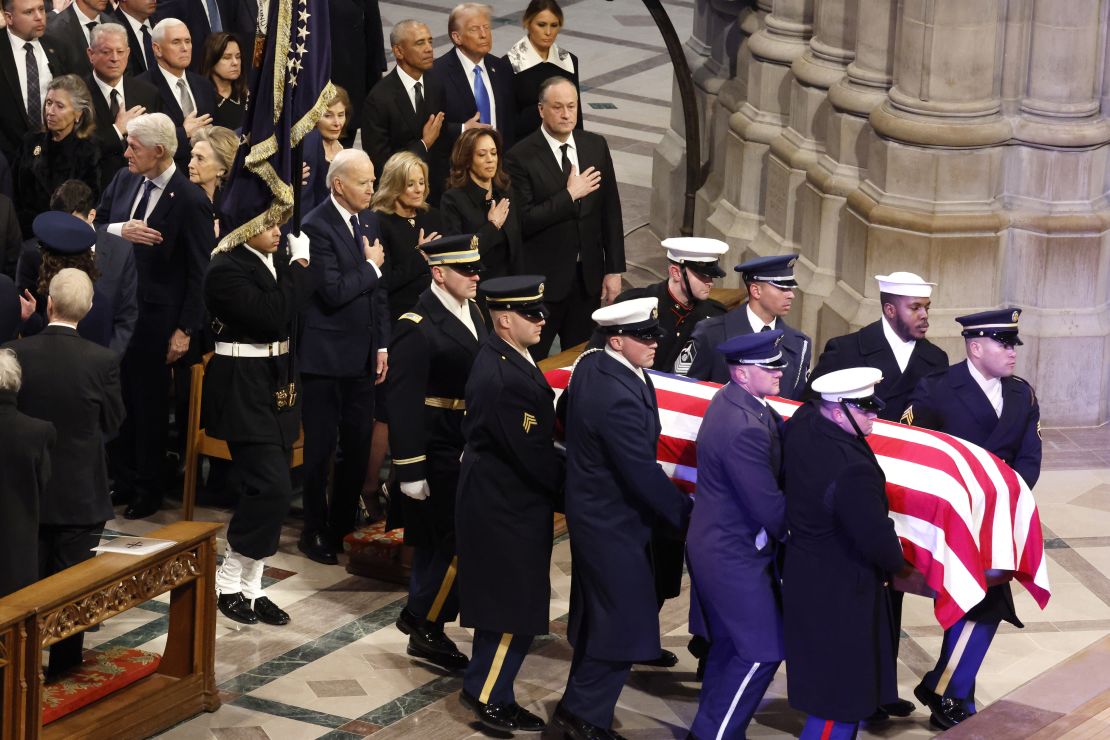 The flag-draped casket of former President Jimmy Carter is carried into the Washington National Cathedral for his state funeral on January 9, 2025.