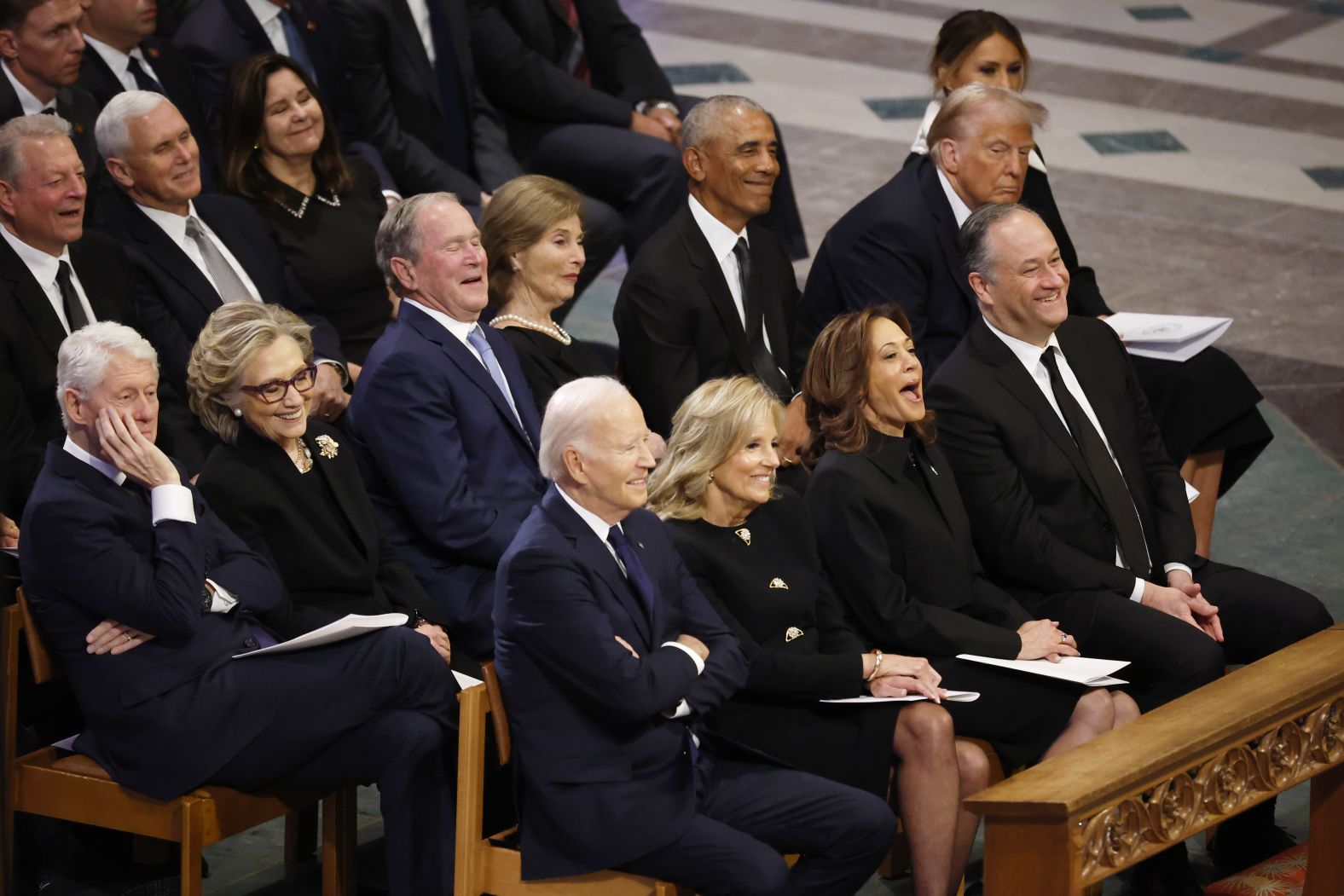 Presidents past and present laugh during part of the funeral service. In the front row, from left, are President Biden, first lady Jill Biden, Vice President Kamala Harris and second gentleman Doug Emhoff. In the second row, from left, are former President Bill Clinton, former Secretary of State Hillary Clinton, former President George W. Bush, former first lady Laura Bush, former President Barack Obama, President-elect Donald Trump and former first lady Melania Trump. In the third row, from left, are former Vice President Al Gore, former Vice President Mike Pence and former second lady Karen Pence.