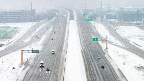 In an aerial view, vehicles travel along the President George Bush highway on January 09, 2025 in Plano, Texas. A winter storm warning is in effect as a strong cold front has brought freezing temperatures across multiple counties in Northern Texas. Storm warnings and advisories are in effect for more than 20 states around the country.