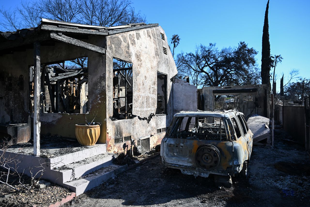 A view of a burned house and a car in Altadena, Los Angeles County, California, on January 13.