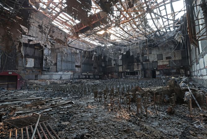 A burned fire extinguisher sits in the auditorium at the Eliot Arts Magnet Academy, which was destroyed by the Eaton Fire in Altadena.