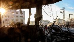 People inspect the site of Israeli bombardment on a residential block in Jalaa Street in Gaza City on January 14, 2025 amid the ongoing war in the Palestinian territory between Israel and Hamas. (Photo by Omar AL-QATTAA / AFP) (Photo by OMAR AL-QATTAA/AFP via Getty Images)