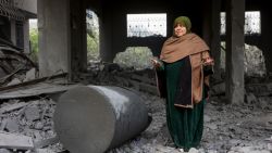 A Muslim woman prays in the rubble of a building hit in Israeli strikes the previous night in Jabalia in the northern Gaza Strip, on January 16, 2025, following a truce announcement amid the war between Israel and the Palestinian Hamas movement. (Photo by Omar AL-QATTAA / AFP) (Photo by OMAR AL-QATTAA/AFP via Getty Images)