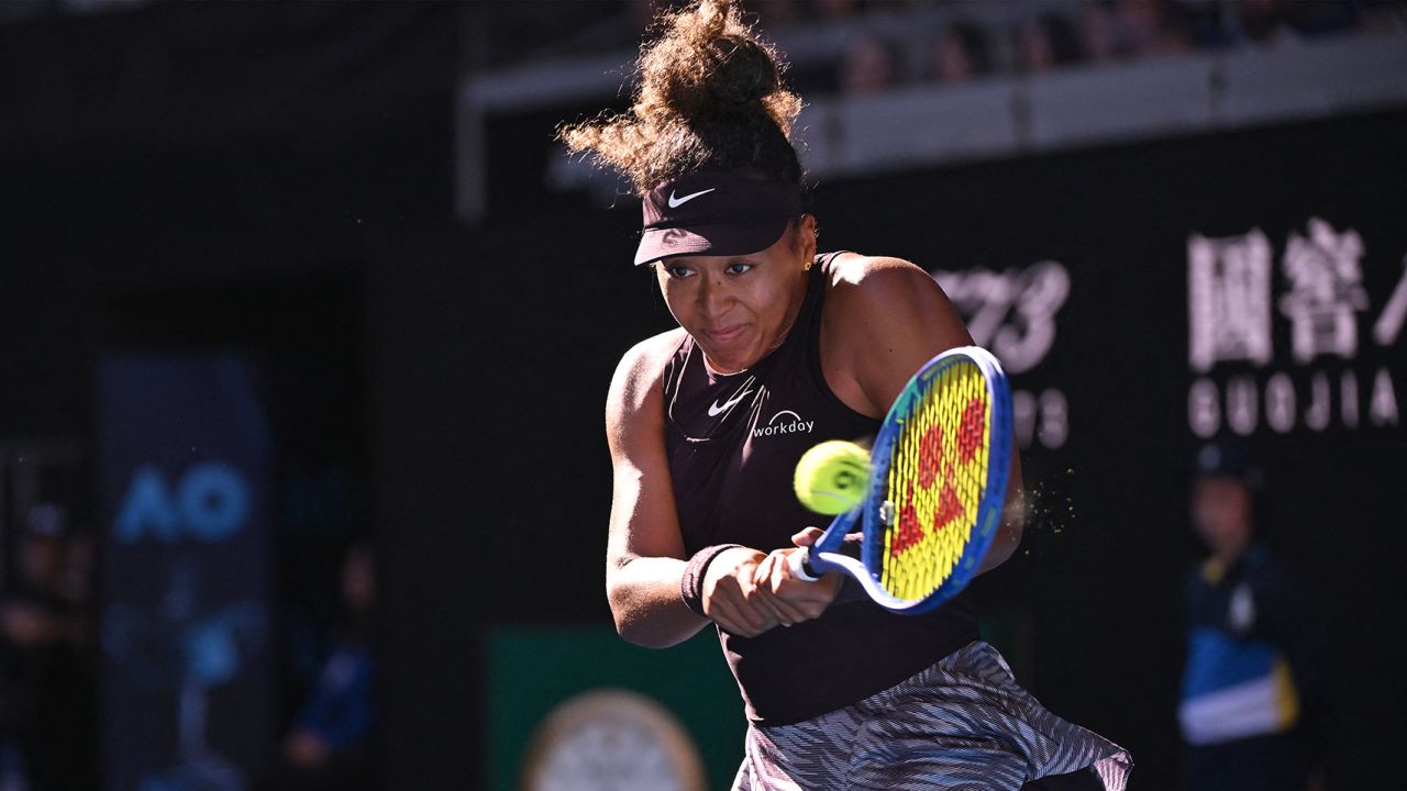 Japan's Naomi Osaka hits a return against Switzerland's Belinda Bencic during their women's singles match on day six of the Australian Open tennis tournament in Melbourne on January 17, 2025. (Photo by WILLIAM WEST / AFP) / -- IMAGE RESTRICTED TO EDITORIAL USE - STRICTLY NO COMMERCIAL USE -- (Photo by WILLIAM WEST/AFP via Getty Images)
