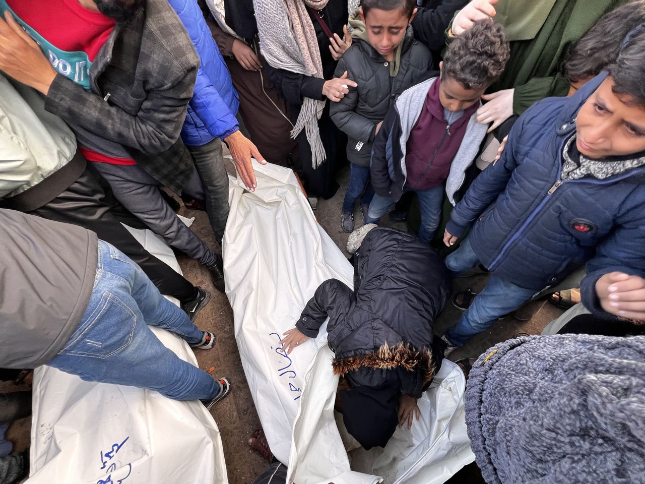 Relatives of Palestinians those who killed in Israeli attacks mourn after Israeli airstrike in Khan Younis, Gaza, on Friday.