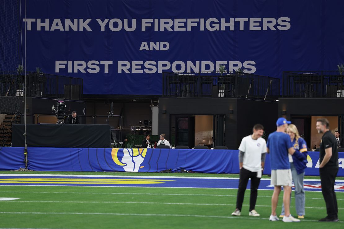 Firefighters and first responders were honored with signs and gear worn by players and coaches on Monday.