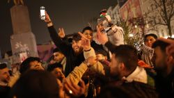 BERLIN, GERMANY - JANUARY 15: Young Arab men celebrate the announcement of the Gaza ceasefire on January 15, 2025 in Berlin, Germany. A ceasefire deal between Israel and Hamas has been reached, Qatar's Prime Minister Sheikh Mohammed Bin Abdulrahman al-Thani confirmed during a press conference in Doha on Wednesday evening. A statement released by the White House said that the deal will, "halt the fighting in Gaza, surge much needed-humanitarian assistance to Palestinian civilians, and reunite the hostages with their families after more than 15 months in captivity." Berlin has a large Arab and also Palestinian community. (Photo by Sean Gallup/Getty Images)