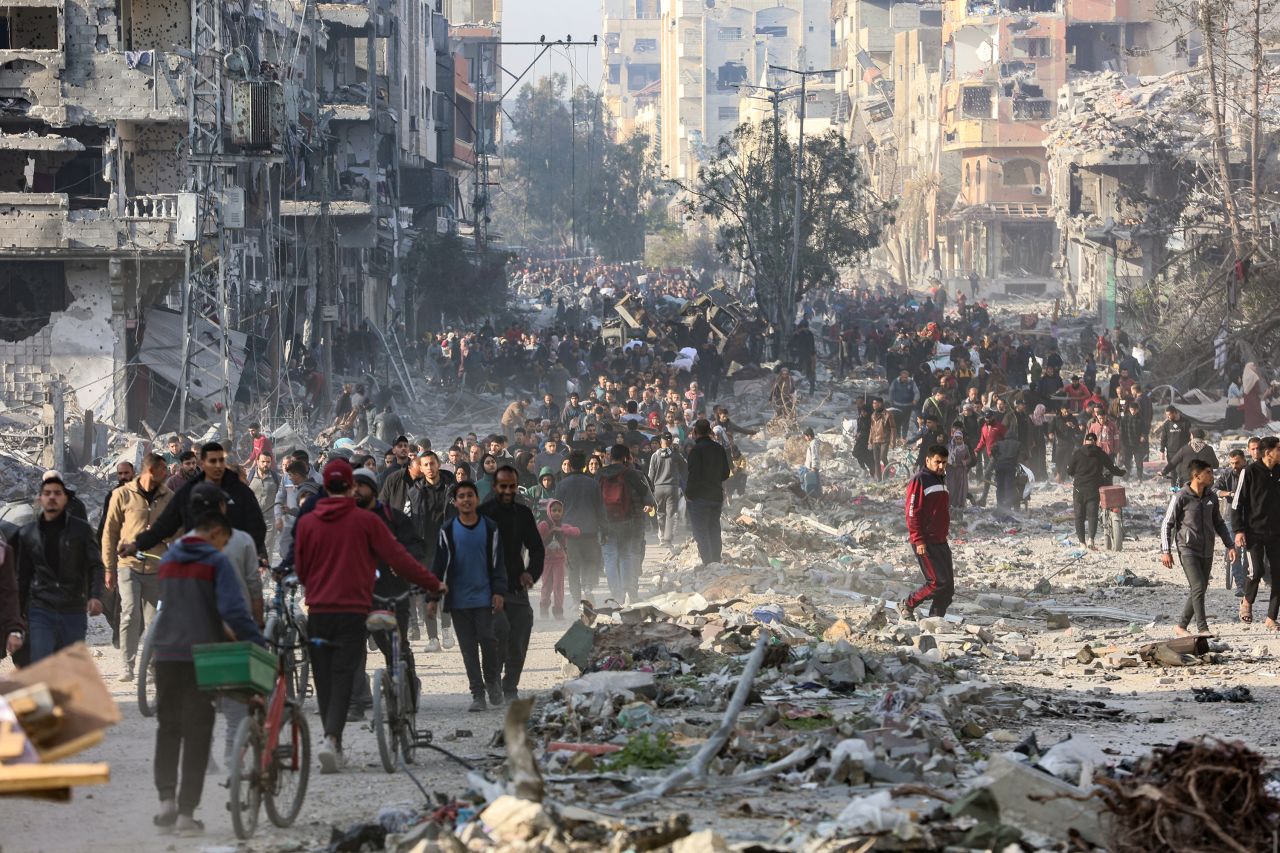 Displaced Palestinians leave areas near Gaza City where they had taken refuge, on Sunday.