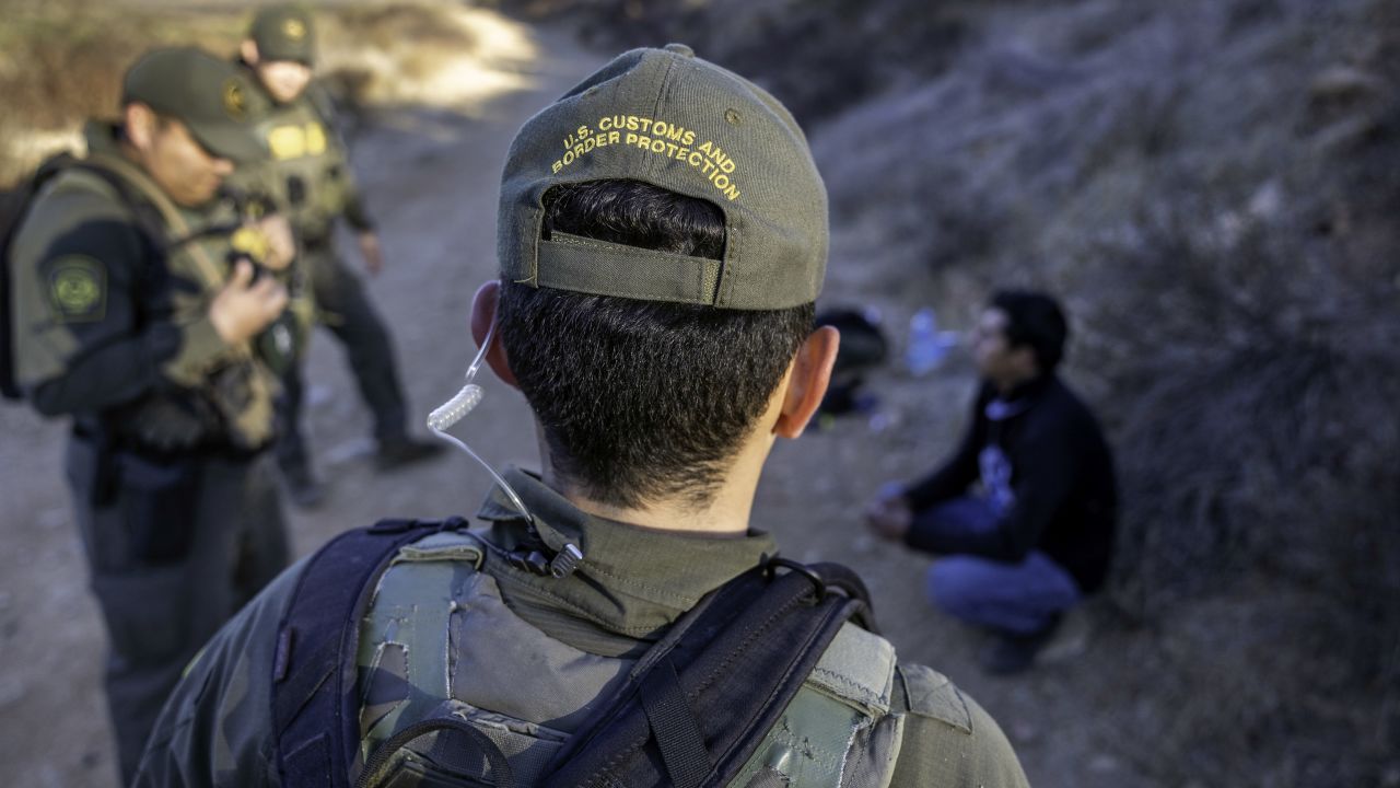 JAMUL, CALIFORNIA - JANUARY 15: U.S. Border Patrol agents detain a migrant who had crossed the border from Mexico on January 15, 2025 near Jamul, California. The number of illegal border crossings remains low as the inauguration of President-elect Donald Trump nears. He has vowed to "seal" the U.S. Mexico border and deport millions of people residing illegally within the United States. (Photo by John Moore/Getty Images)