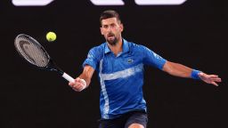 Serbia's Novak Djokovic hits a return against Czech Republic's Jiri Lehecka during their men's singles match on day eight of the Australian Open tennis tournament in Melbourne on January 19, 2025. (Photo by DAVID GRAY / AFP) / -- IMAGE RESTRICTED TO EDITORIAL USE - STRICTLY NO COMMERCIAL USE -- (Photo by DAVID GRAY/AFP via Getty Images)