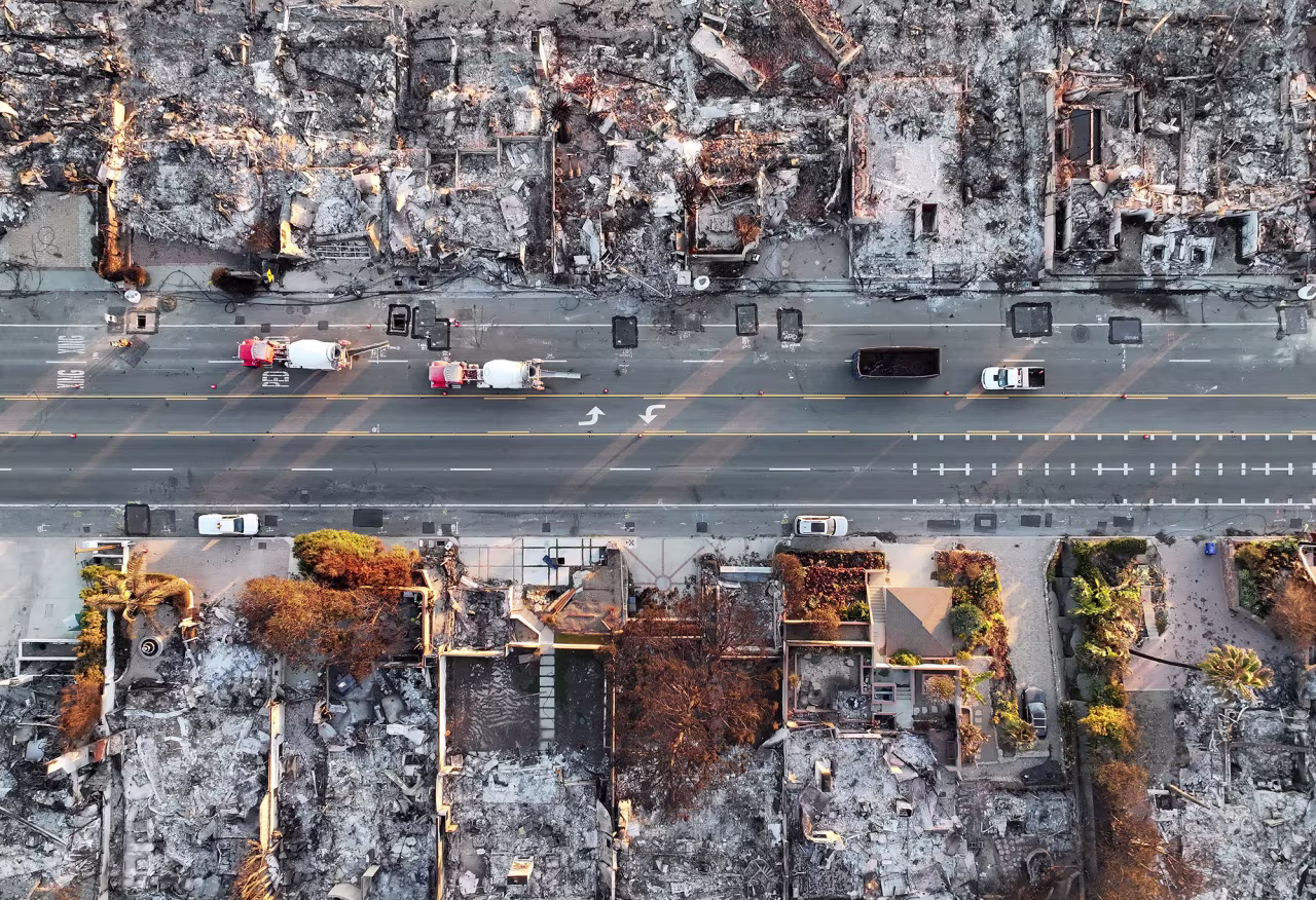 An aerial view of repair vehicles near beachside homes that burned in the Palisades Fire are seen on Wednesday in Malibu.