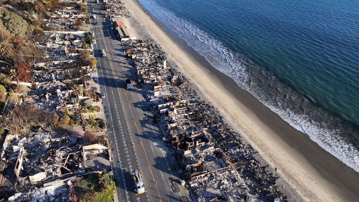 An aerial view of a beachside homes destroyed in the Palisades Fire along Pacific Coast Highway as wildfires cause damage and loss through the LA region on January 16, 2025, in Malibu, California.