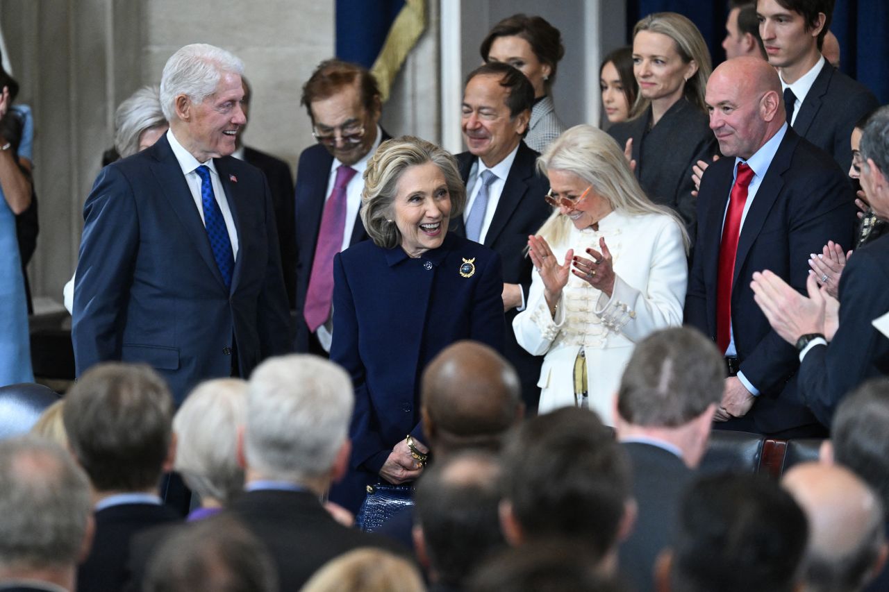 Former President Bill Clinton and former Secretary of State Hillary Clinton arrive in the Capitol Rotunda in Washington, DC, on Monday.