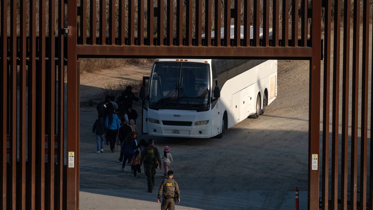 Migrants are processed by Border Patrol San Diego sector agents as seen from Tijuana, Baja California state, Mexico, on January 20, 2025. Donald Trump will issue a raft of executive orders aimed at re-shaping how the United States deals with citizenship and immigration, an incoming istration official told reporters on Monday. (Photo by Guillermo Arias / AFP) (Photo by GUILLERMO ARIAS/AFP via Getty Images)