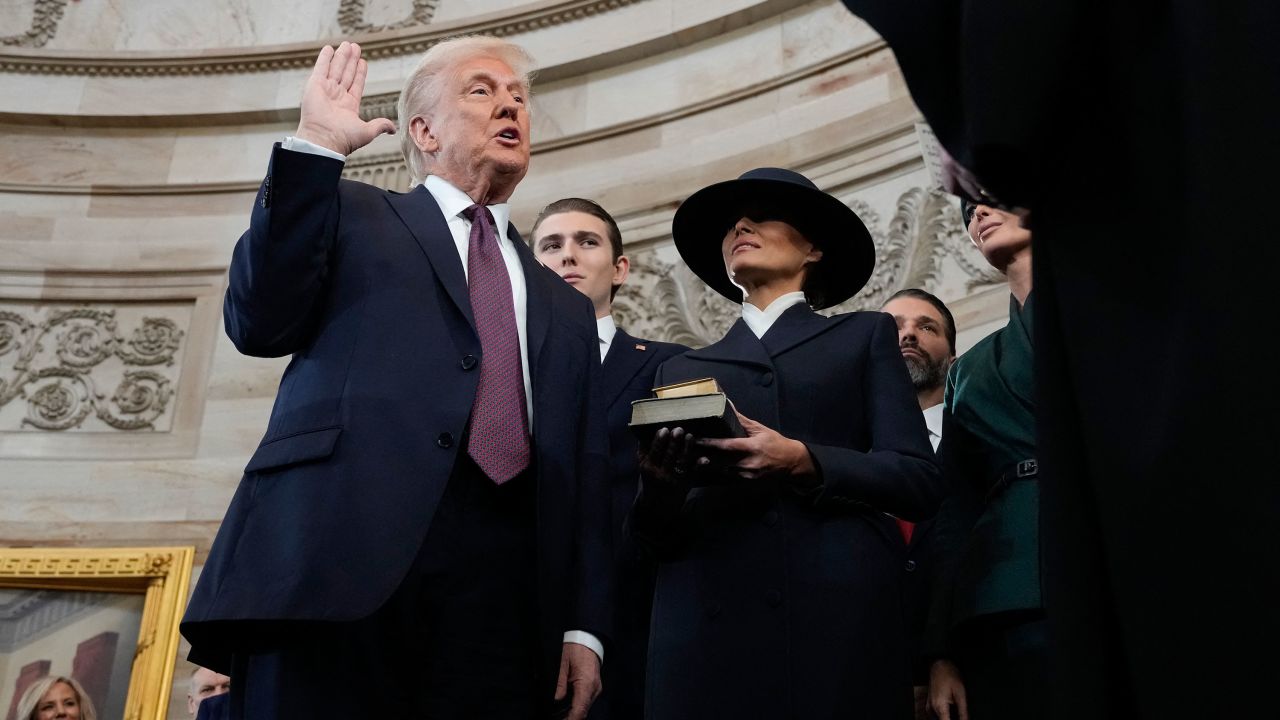 TOPSHOT - Donald Trump is sworn in as the 47th president of the United States by Chief Justice John Roberts as Melania Trump holds the Bible during the 60th Presidential Inauguration in the Rotunda of the U.S. Capitol in Washington, Monday, Jan. 20, 2025. (Photo by Morry Gash / POOL / AFP) (Photo by MORRY GASH/POOL/AFP via Getty Images)