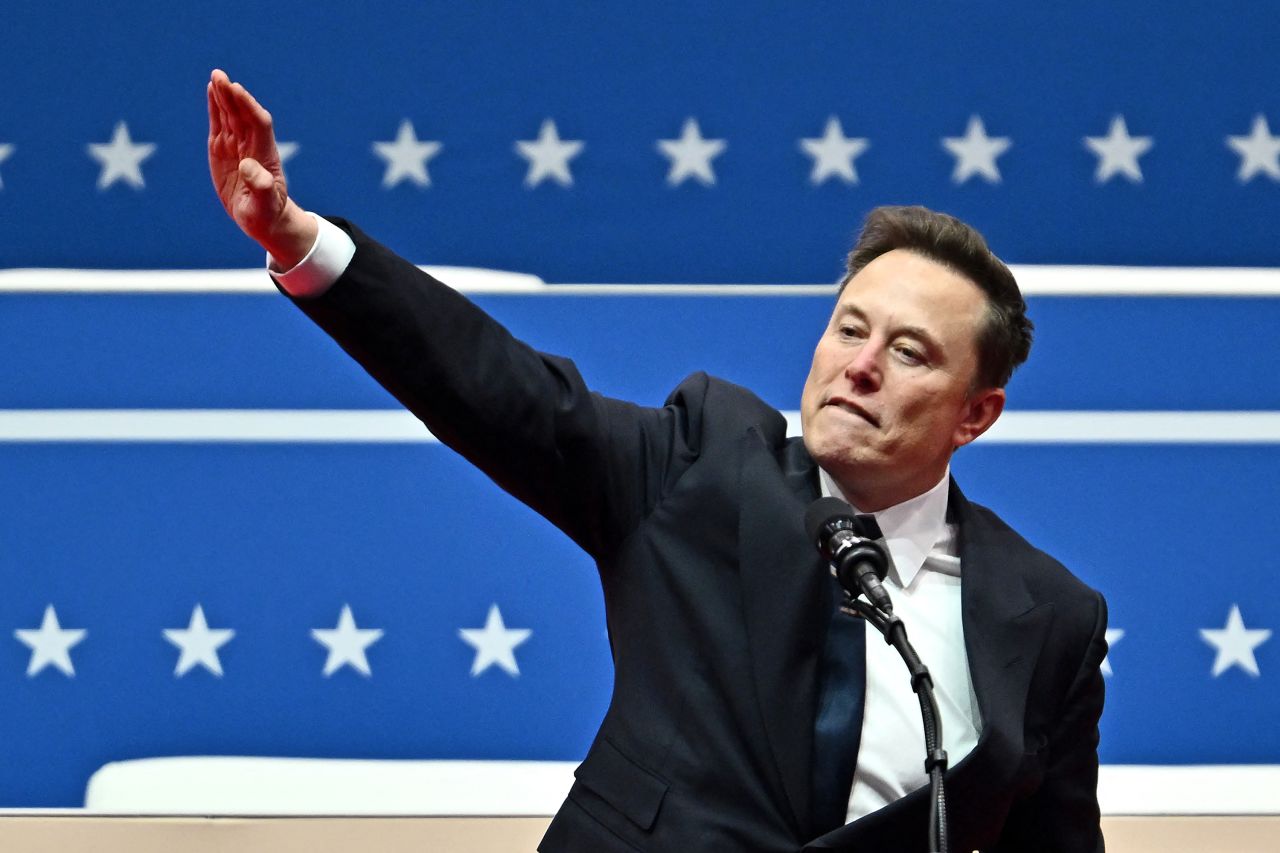 Tesla and SpaceX CEO Elon Musk gestures as he speaks during the inaugural parade inside Capital One Arena, in Washington, DC, on January 20, 2025. (Photo by ANGELA WEISS / AFP) (Photo by ANGELA WEISS/AFP via Getty Images)