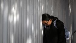 TOPSHOT - An asylum seeker reacts while waiting for news on her CBP One appointments with US authorities before crossing through El Chaparral port in Tijuana, Baja California state, Mexico, on January 20, 2025. Minutes after his inauguration, US President Donald Trump said that he will issue a raft of executive orders aimed at reshaping citizenship and immigration issues stating that he will declare "a national emergency at our southern border" and that "all illegal entry will immediately be halted". (Photo by Guillermo Arias / AFP) (Photo by GUILLERMO ARIAS/AFP via Getty Images)