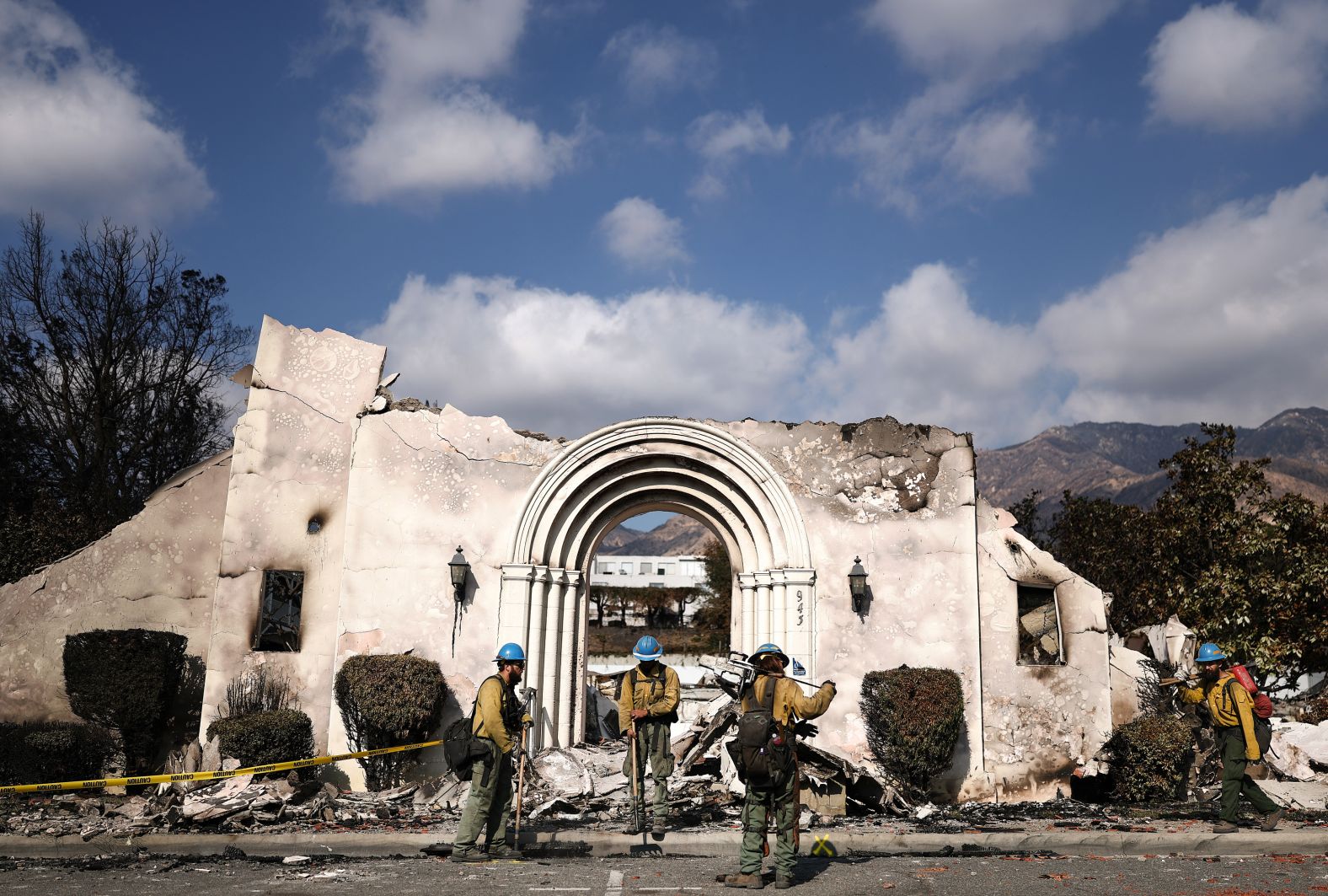 Private firefighters from Oregon gather in front of Altadena Community Church.