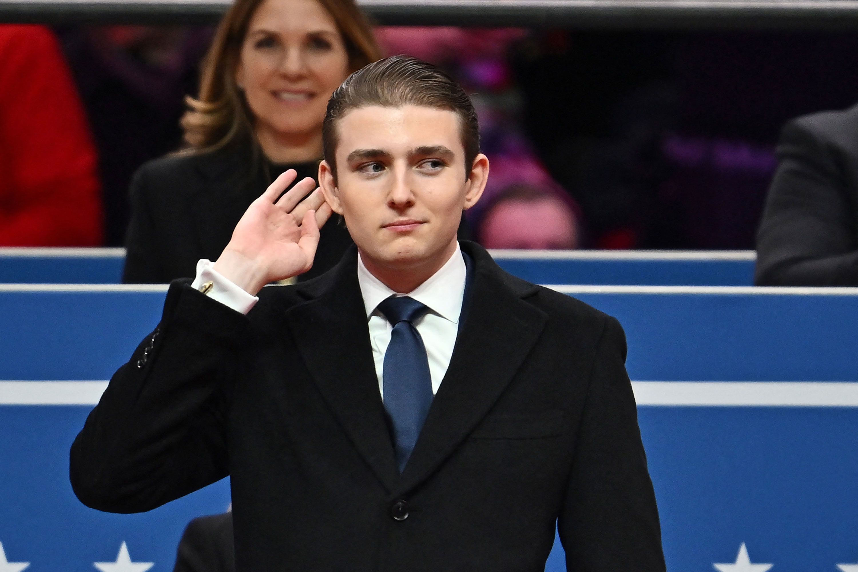 Barron Trump gestures after being acknowledged by his father in Capital One Arena on Monday.