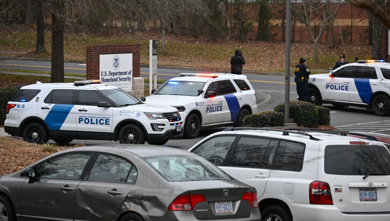 Immigration officers are seen outside a Department of Homeland Security office in Charlotte, North Carolina, on Tuesday.