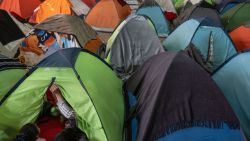 An asylum seeker sits on the tent he occupies at Juventud 2000 migrant shelter in Tijuana, Baja California state, Mexico, on January 21, 2025. Mexico will offer humanitarian protection to migrants that the United States deports to its territory, President Claudia Sheinbaum said Tuesday, after her counterpart Donald Trump announced an all-out war against illegal migration. (Photo by Guillermo Arias / AFP) (Photo by GUILLERMO ARIAS/AFP via Getty Images)