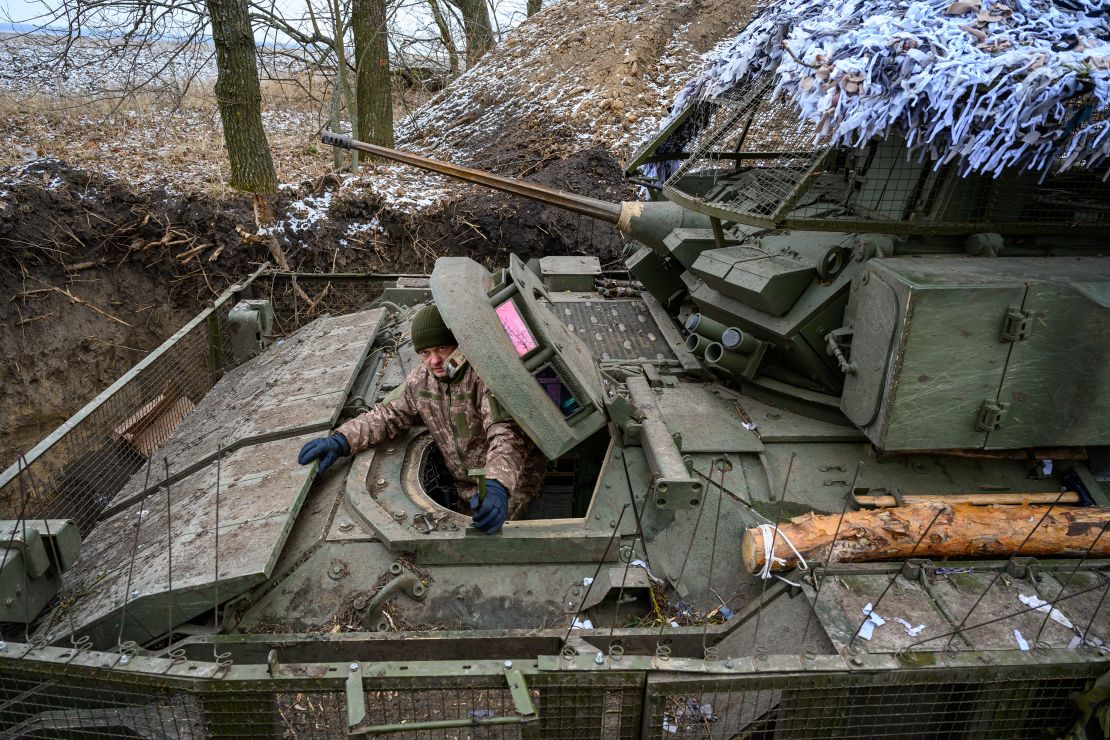 A driver sits in his vehicle, as Ukrainian Army soldiers use American Bradley Fighting Vehicles during Ukraine's on-going cross-border operation into Russias Kursk region.