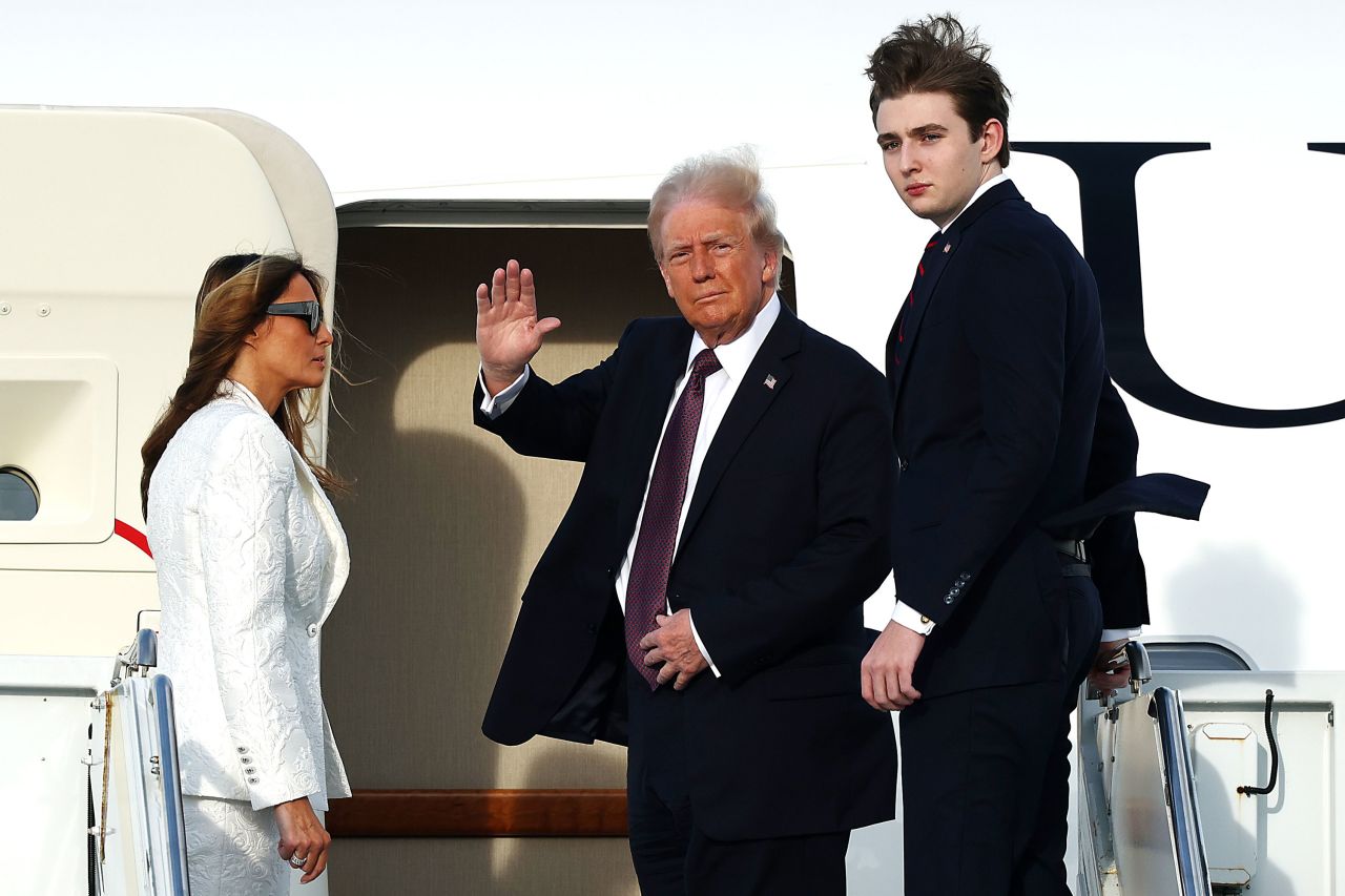 President-elect Donald Trump, Melania Trump and their son Barron board a US Air Force aircraft en route to Dulles, Virginia, on Saturday in West Palm Beach, Florida.