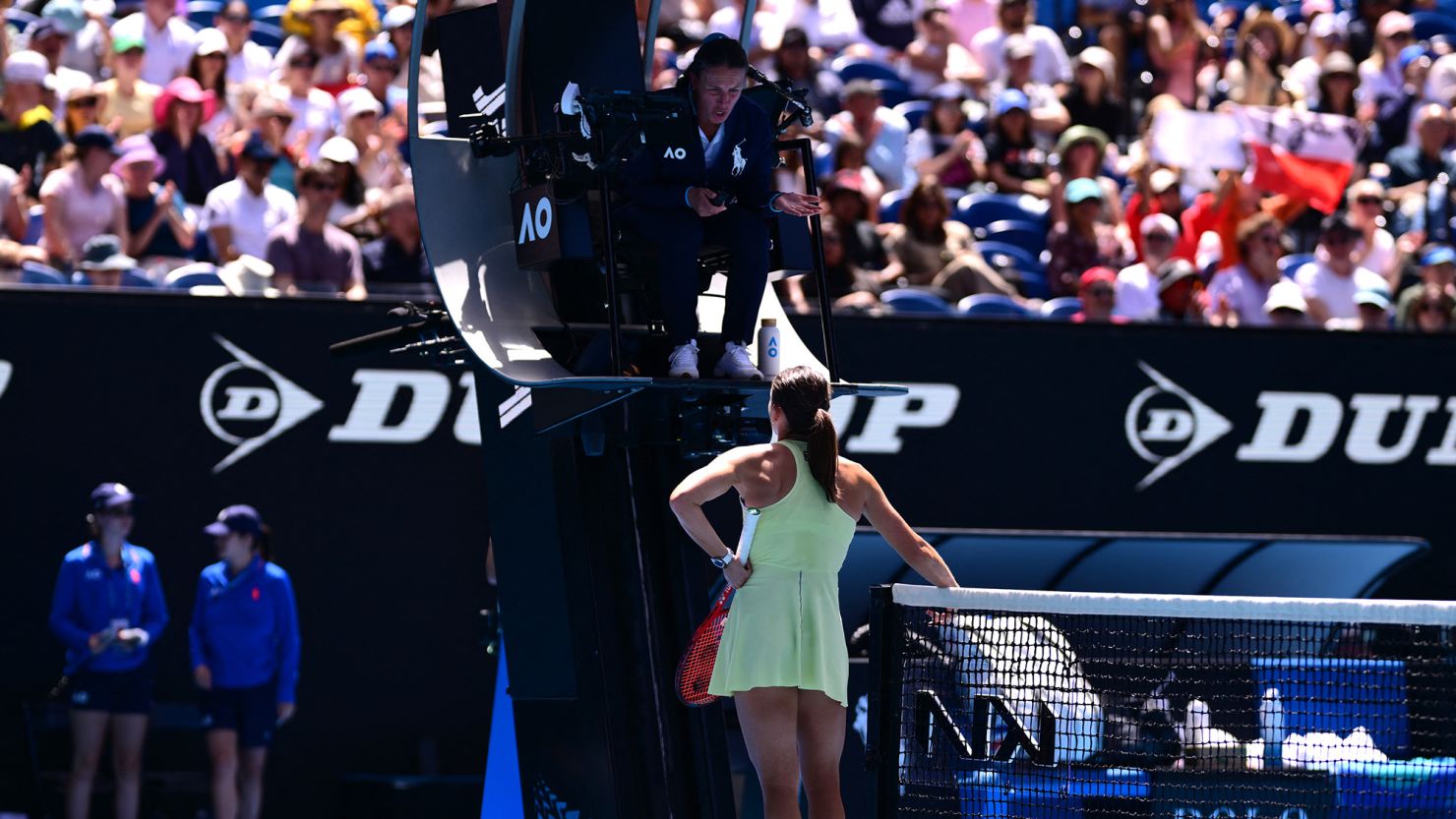 Emma Navarro speaks with the umpire over a controversial point won by Iga Świątek.