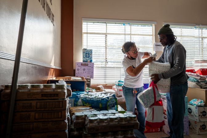 Community members work together at the Victory Bible Church in Pasadena. The church continues to operate as a sanctuary for people affected by the Eaton Fire.