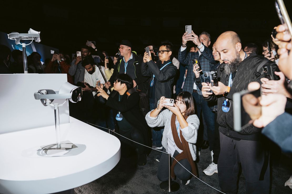 Attendees photograph Samsung's Project Moohan mixed-reality headsets with Google at the Galaxy Unpacked event in San Jose, California, on January 22, 2025.