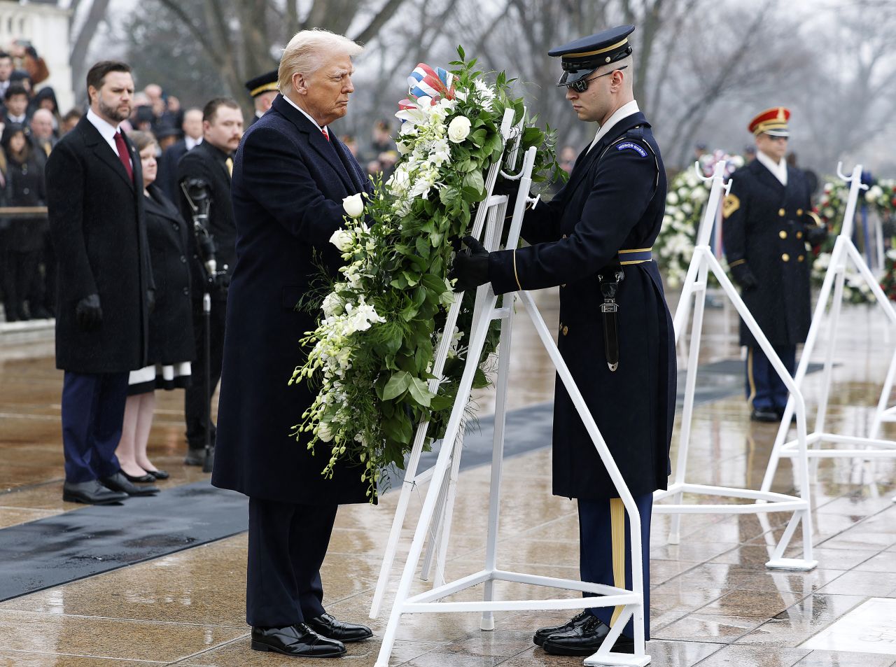 President-elect Donald Trump participates in a wreath-laying ceremony, as Vice President-elect JD Vance looks on, at Arlington National Cemetery in Arlington, Virginia, on Sunday.